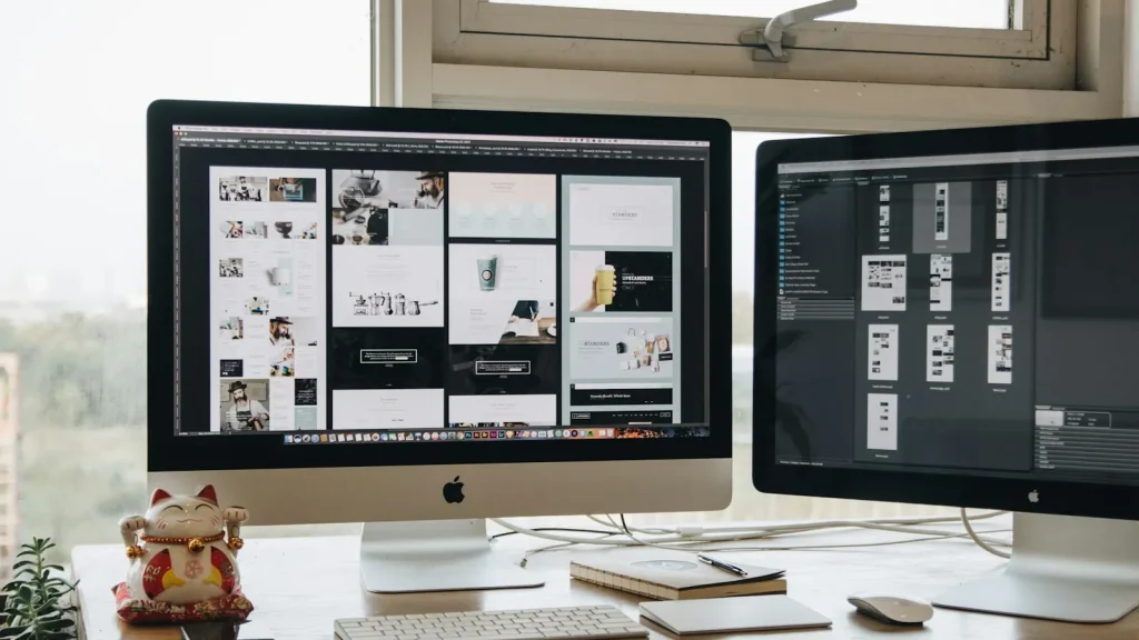 Web design workspace with dual monitors